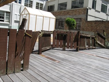 Greenhouse and borrowed fence: works by Ross Forbes and Anthony Cribb on the the terraced rooftop next to CNZ's Auckland offices.