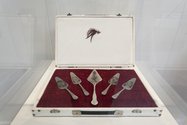 Diane Victor, The Server, 1995, set of five engraved servers on leatherette with fishing fly. Collection of Gordon Froud. Photo: Sam Hartnett