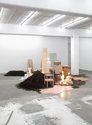 Eve Armstrong, Experience Tells Us, 2011, crushed scoria,paving stones,wall blocks,light bulbs, newsprint, newspaper,polystyrene, lamp bases, tiles, shower door, ceramic vases, tables, carpet, stools, display stands, ceiling panels, plastic cup, fabric...