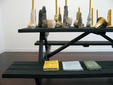 Detail of Richard Orjis installation, by quiet volcanoes. on the seat are painted ceramic 'books' by Tessa Laird.