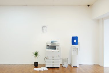 Emil Dryburgh, Ophelia (office tableau #1), Inkjet prints A4 -A3, Dracaena, photocopier, rubbishbin, watercooler (photocopier provided by Ricoh)