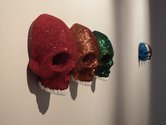 Mark Curtis, Glitter Skulls, 2015, twenty glitter on plastic skulls as installed at the Wallace Gallery, Morrinsville. Courtesy of the Wallace Trust