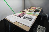 Exhibition design by Andrew Kennedy. Table with contextual reading matter. Photo: Sam Hartnett