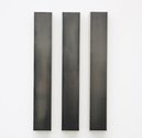 Matthew Allen, Vertical I, II & III, 2017, polished graphite on linen, 76 x 11 cm each